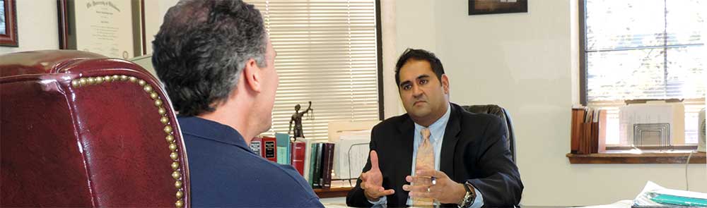 photo of OKC Attorney Neelam Patel meeting in office with client